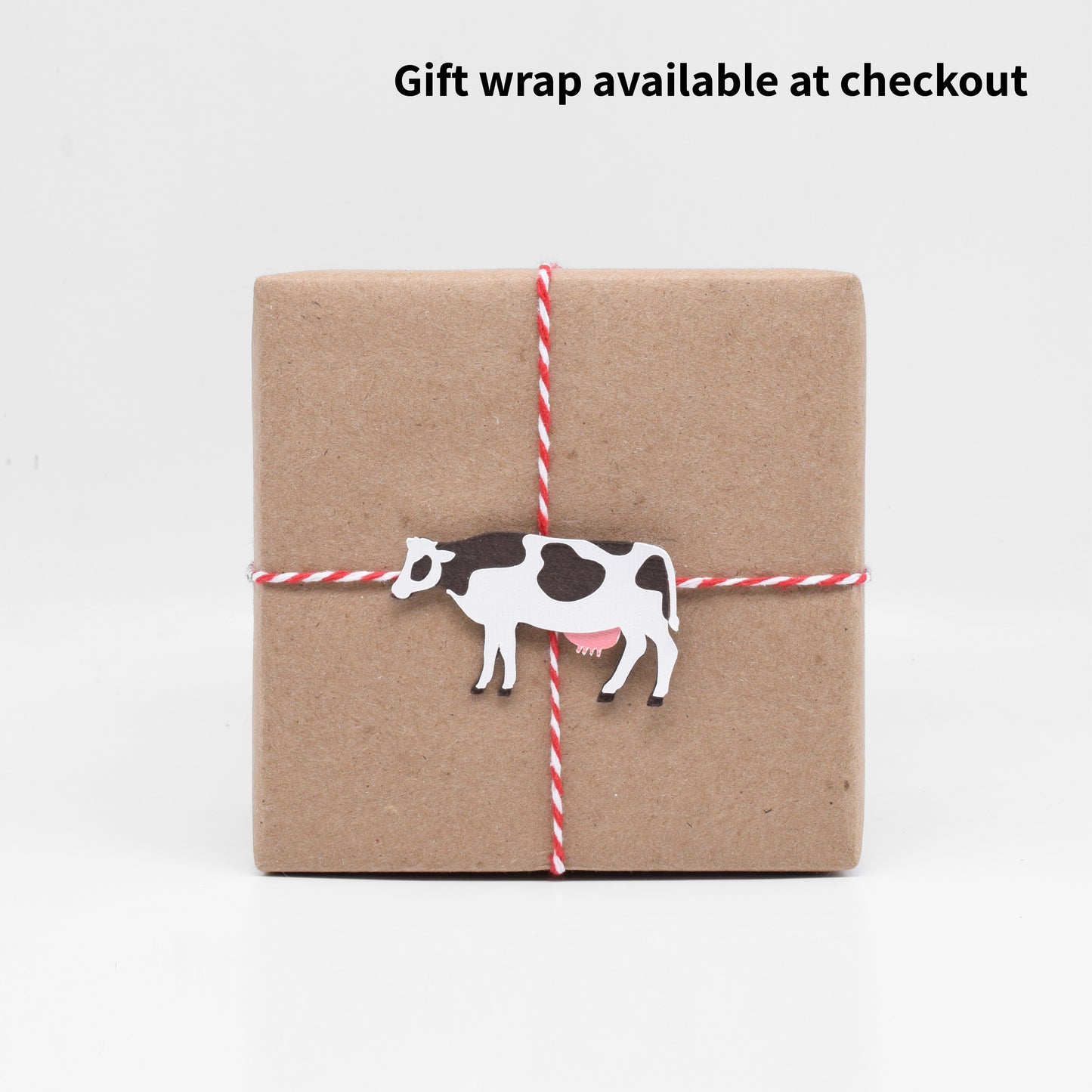 The gift wrap features a paper cutout of a cow, in honor of the legend that the Great Chicago Fire was started by Mrs. O'Leary's cow.