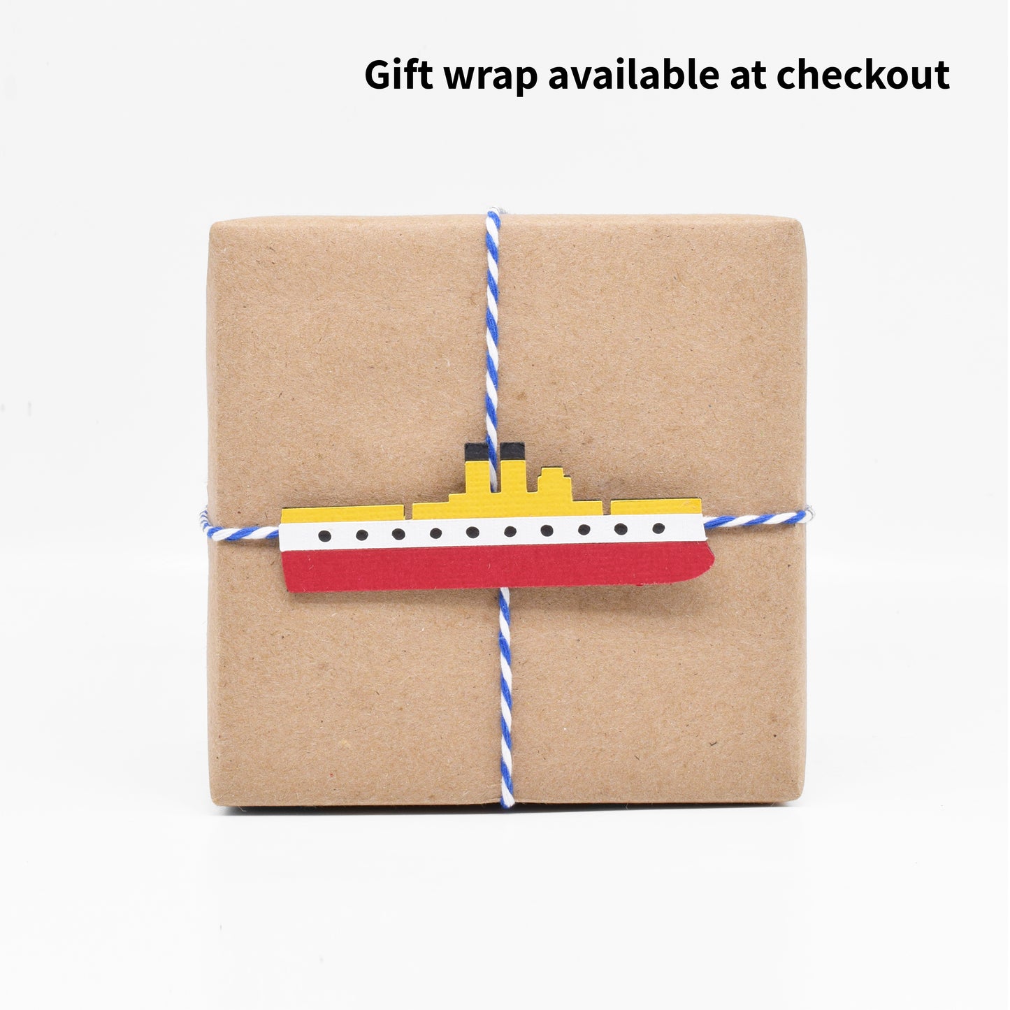 The gift wrap features a paper cutout of the warship the USS Maine.