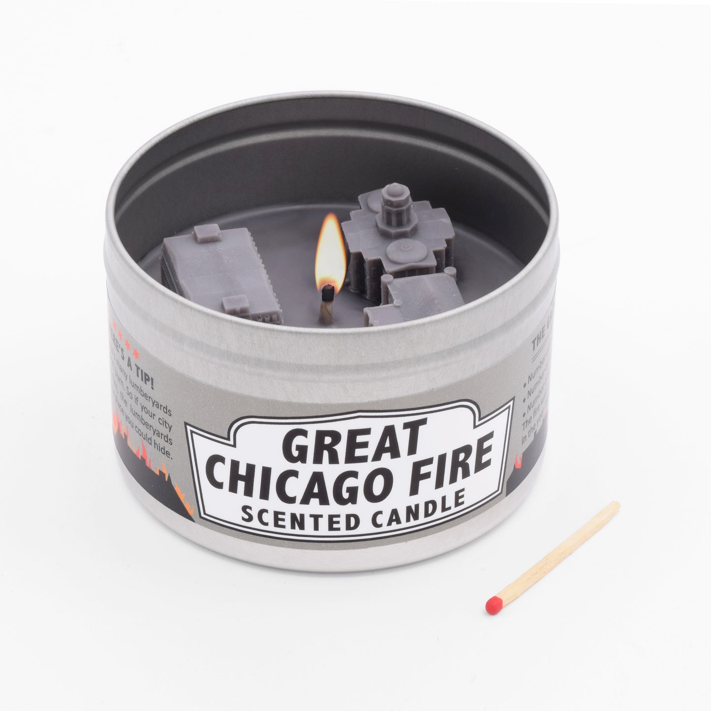 The Great Chicago Fire Scented Candle smells like woodsmoke, and the surface features wax replicas of actual buildings that were destroyed during the Great Chicago Fire.