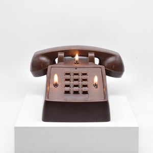 Candle replica of a push button telephone