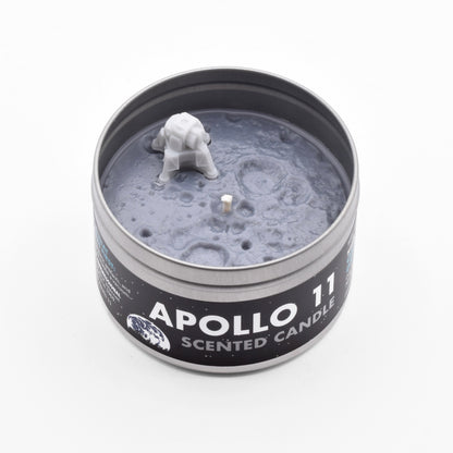 The Apollo 11 Scented Candle smells like Tang and has a miniature lunar module on its surface.