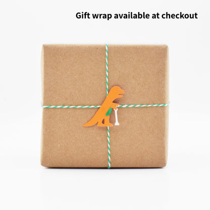 The gift wrap has an orange dinosaur on it that is an iconic landmark near Jacksonville Beach. 