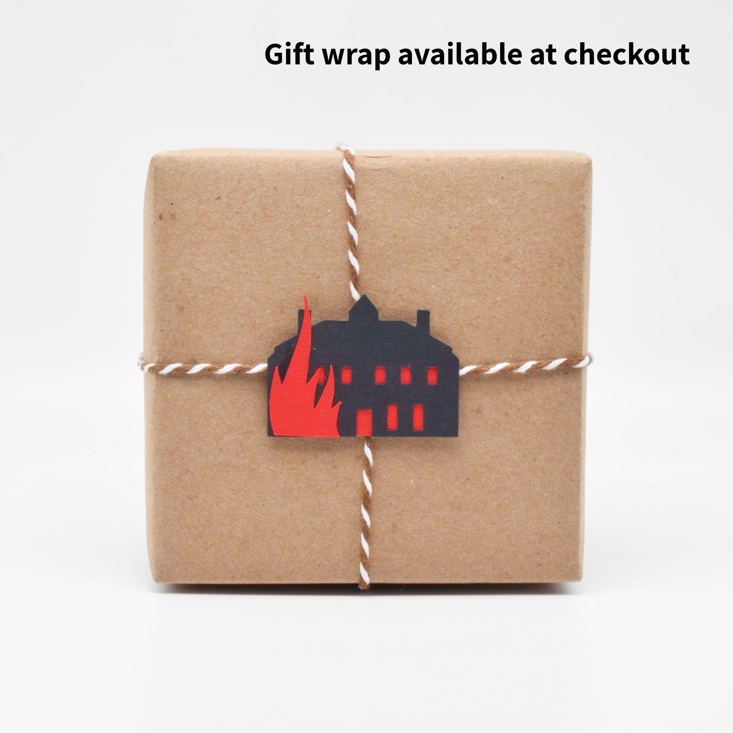 The gift wrap features a tiny paper cutout of Thornfield Manor going up in flames. 