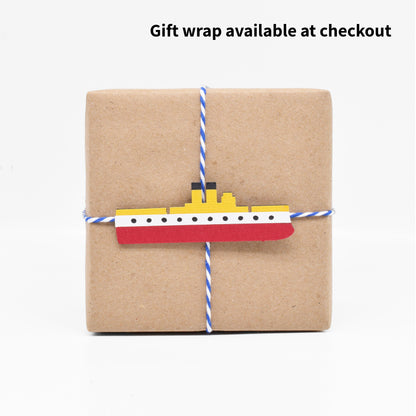 The gift wrap features a paper cutout of the warship the USS Maine. 