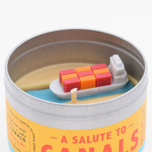 Load image into Gallery viewer, The Salute to Canals candle has a miniature container ship on its surface, making it a funny and unique gift for someone who remembers the Ever Given ship was stuck in the Suez canal.