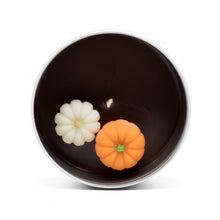 Load image into Gallery viewer, The candle has a miniature wax pumpkin patch on its surface.