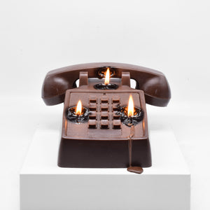 Candle replica of a push button telephone